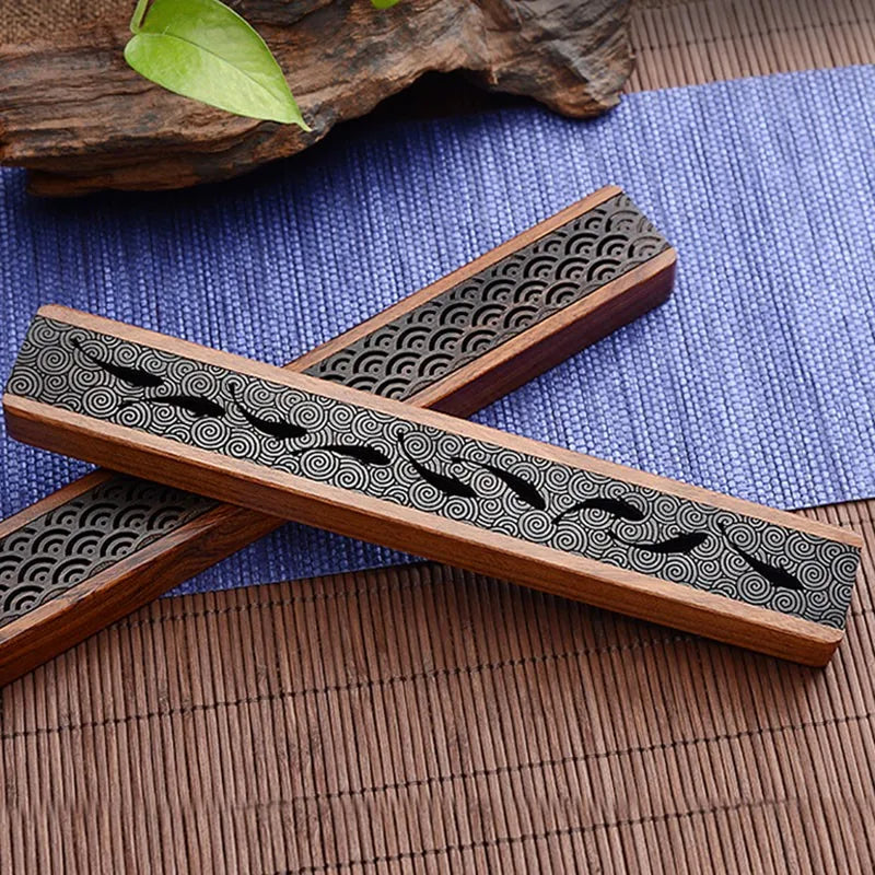 Black wooden incense burner box in handmade retro style for holding incense sticks during prayer, yoga, and home fragrance use.