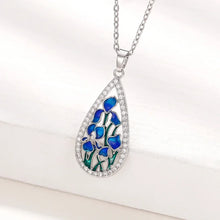 Blue flower CZ teardrop pendant necklace for elegant outfits, party wear, and jewelry gifting.