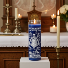 Our Lady of Regla blue devotional candle in tall glass jar for daily prayer, spiritual focus, and religious practice.