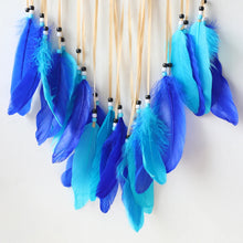 Boho Evil Eye dream catcher with blue feathers for home decor, energy protection, and dreamy wall display.