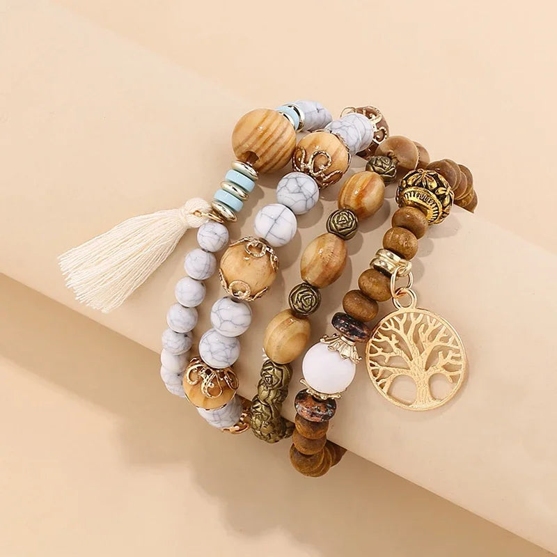 Boho layered wooden bead bracelet set with tassel accents for wrist stacking, casual wear, and bohemian outfit styling.