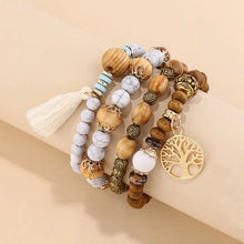Boho layered wooden bead bracelet set with tassel accents for wrist stacking, casual wear, and bohemian outfit styling.