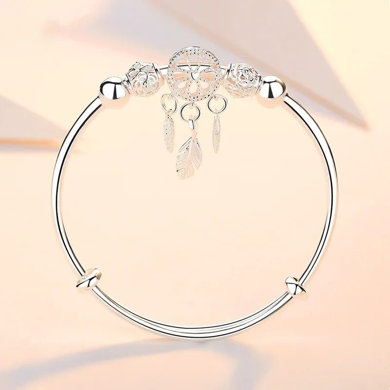 Silver Dreamcatcher Charm adjustable bangle for boho fashion, accessory styling, and gift-ready jewelry wear.
