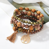 Boho stacking Tree of Life bracelet set with beaded elastic bracelets for mixing with other jewelry, casual wear, and bohemian fashion.