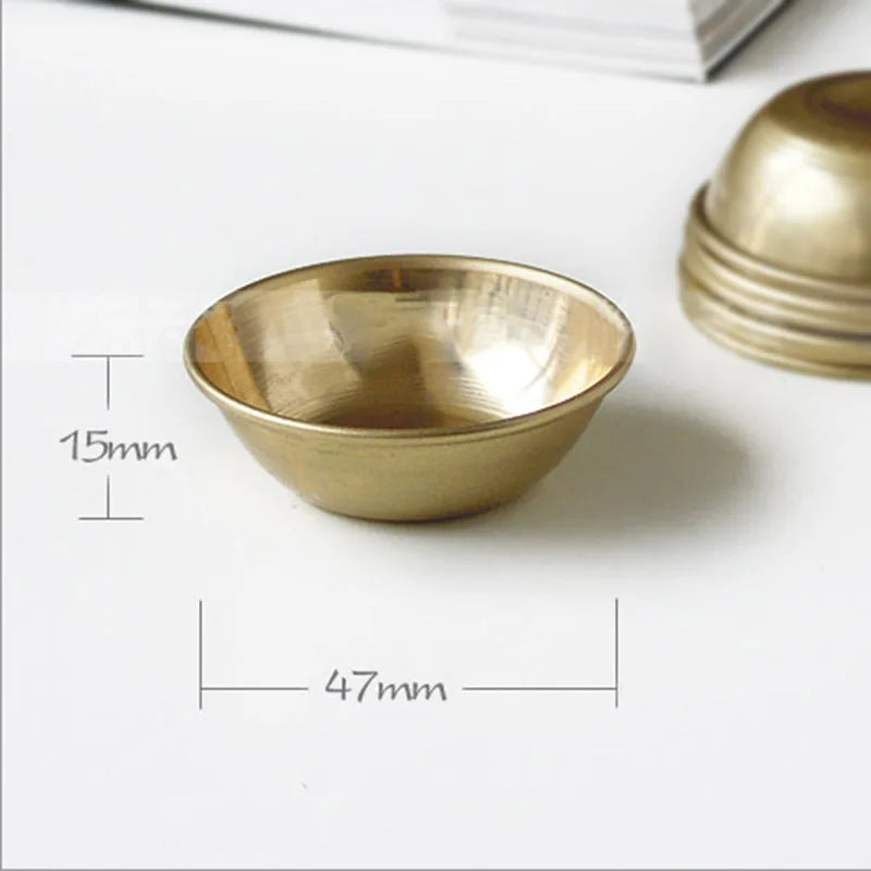 Buddhist brass offering bowl set with mini bowls for altar offerings, meditation rituals, and sacred space arrangement.