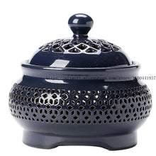 Ceramic electric fragrance oil burner lamp for warming scented oils and providing gentle light for relaxation and meditation.