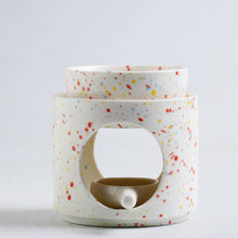 Ceramic essential oil warmer and incense burner for scented oil diffusion, incense burning, and soothing self-care rituals.