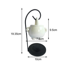 Ceramic fragrance oil burner diffuser for warming scented oils and creating a soothing home environment.