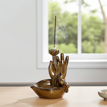 Ceramic Mudra Hand backflow incense burner for aromatherapy, mindfulness practice, and calming room ambiance.