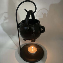 Ceramic oil burner tealight diffuser for diffusing scented oils and creating a relaxing aromatherapy atmosphere.