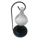 Ceramic wax warmer tealight diffuser for melting scented wax and adding fragrance to bedrooms or lounges.