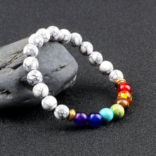 Chakra Healing Lava Stone beaded bracelet for spiritual cleansing, energy balance, and meditation sessions.
