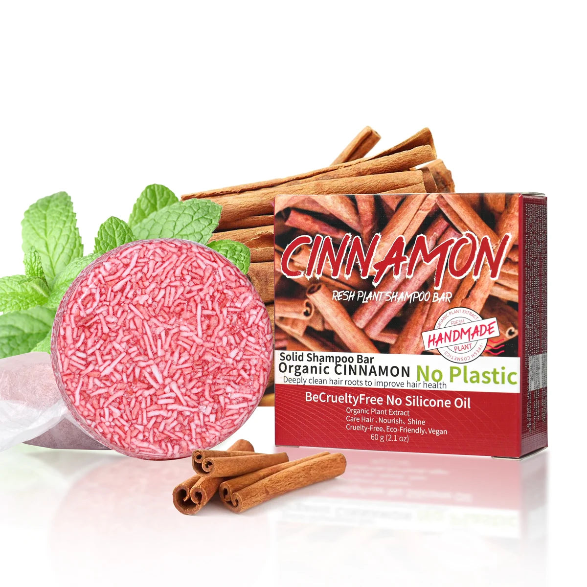 Cinnamomum Herbal Solid Shampoo Bar next to cinnamon sticks and mint leaves on white background.