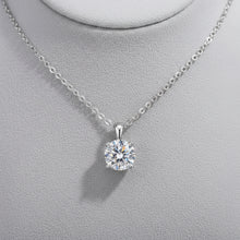 Classic moissanite four-prong necklace with solitaire pendant for timeless jewelry wear, weddings, and personal gifting.