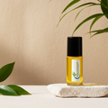 Coco Mademoiselle body oil bottle for moisturizing skin and layering a fresh floral fragrance.