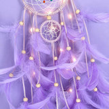 Colorful feather dream catcher handmade hanging décor for bedroom decoration, restful sleep space styling, and boho wall accent use.
