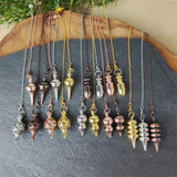 Cone-Shaped Copper Brass Pendulum for dowsing, divination, and energy work.