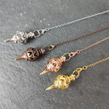 Cone-Shaped Copper Brass Pendulum for dowsing, divination, and energy work.