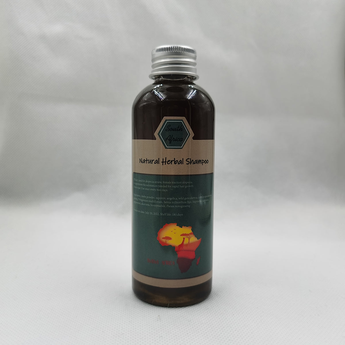 Crazy Growth Oil with Chebe Powder 100ml bottle with label on gray background.