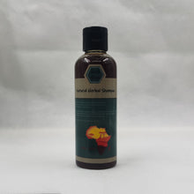 Crazy Growth Oil with Chebe Powder 100ml bottle side view on gray background.
