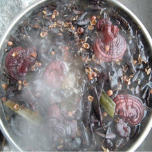 Crazy Growth Oil with Chebe Powder natural ingredients being prepared in pot.