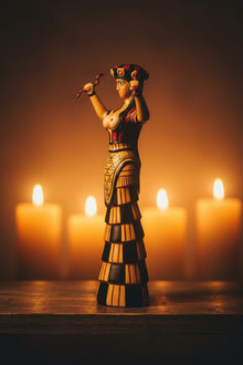 Cretan Snake Goddess statue, side profile view
