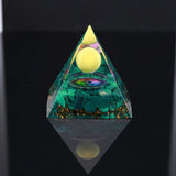 Crystal Orgone Pyramid with Amethyst & Peridot for meditation, energy healing, and home décor.