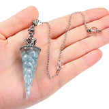 Crystal pendulum with aquamarine and 7-chakra design for divination, energy alignment, and prayer use.