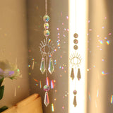 Crystal Prism Sun Catcher Wind Chime hanging crystal decor for window use, rainbow light reflection, and elegant home decoration.