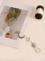Crystal Star and Moon suncatcher wall hanging for catching sunlight, creating rainbow reflections, and decorating living spaces.