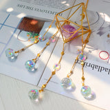 Crystal Wind Chime Dreamcatcher window hanging for light-catching decor, calming atmosphere, and indoor display.