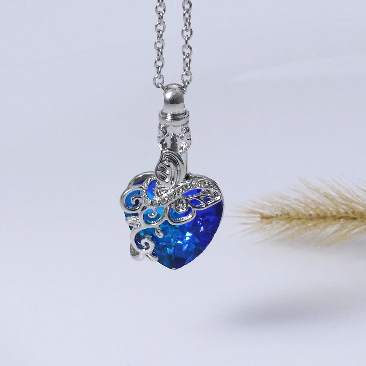 Dainty sapphire teardrop pendant necklace in silver for office wear, elegant occasions, and minimalist layering.