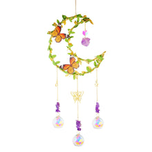 Decorative crystal prism suncatcher wind chime with hanging crystal elements for rainbow light display, sunlight reflection, and indoor or outdoor decoration.