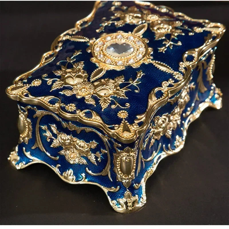 Decorative European metal jewelry box ornament case for displaying and storing jewelry on a dresser or vanity.