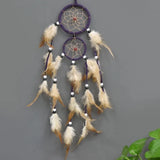 Decorative Indian Dream Catcher brown feather wall art for bedroom wall decor, bohemian interior design, and gift giving.