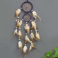 Decorative Indian Dream Catcher brown feather wall art for bedroom wall decor, bohemian interior design, and gift giving.