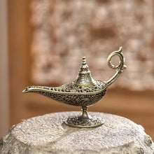 Decorative metal incense burner with candle holder for aromatherapy, relaxation, and altar decor.