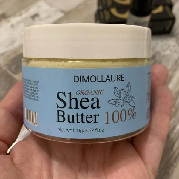 Dimollaure Organic Shea Butter Oil 100g jar held in hand for daily skin moisturizing and nourishing care.