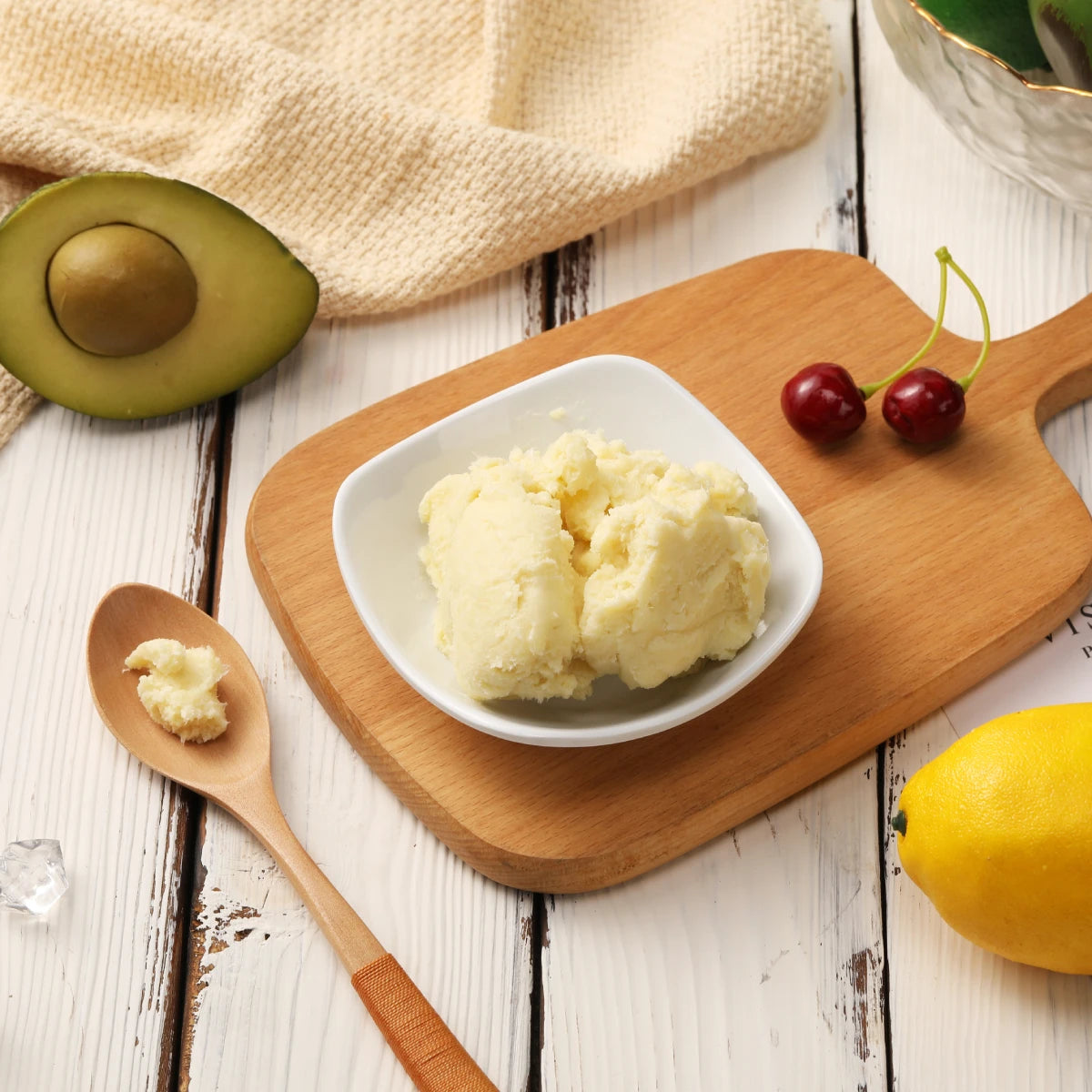 Dimollaure Organic Shea Butter Oil with natural ingredients on wooden surface showing pure and organic formula.