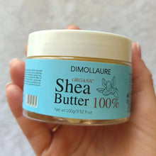 Dimollaure Organic Unrefined Shea Butter Oil jar held in hand for daily skin care and moisturizing.