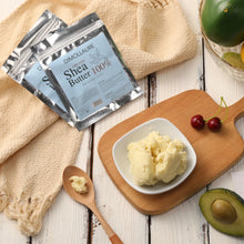 Dimollaure Unrefined Shea Butter 50g in bowl with wooden spoon and natural ingredients on wooden surface.