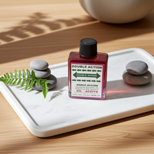 Double Action Wish Oil ritual oil bottle for candle dressing, prayer work, and spiritual practice.