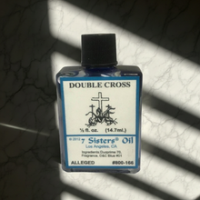 Double Cross Wish Oil bottle for ritual use, focused intention, and spiritual wishing practice.