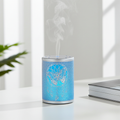 Dream Catcher white metal ultrasonic diffuser for dispersing essential oils, freshening rooms, and creating a calming home atmosphere.