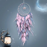 Dream catcher with rainbow colorful feathers hanging decor for bright room styling, wall decoration, and gift giving.
