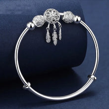 Dreamcatcher feather bead tassel bangle bracelet for casual outfits, festival styling, and layered jewelry looks.