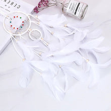 Dreamcatcher pendant light with LED and feathers for nighttime room decor, calming ambiance, and hanging ornament use.