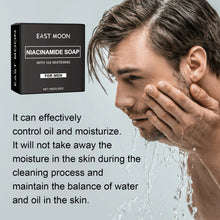 East Moon Niacinamide Whitening Acne-Fading Soap man washing face with box on gray background.