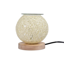Electric essential oil and wax melt warmer lamp for scented wax cubes and essential oil fragrance in the home.