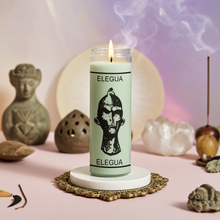 Elegua white 7 day candle in glass jar for spiritual offerings, altar work, and devotional ritual use.